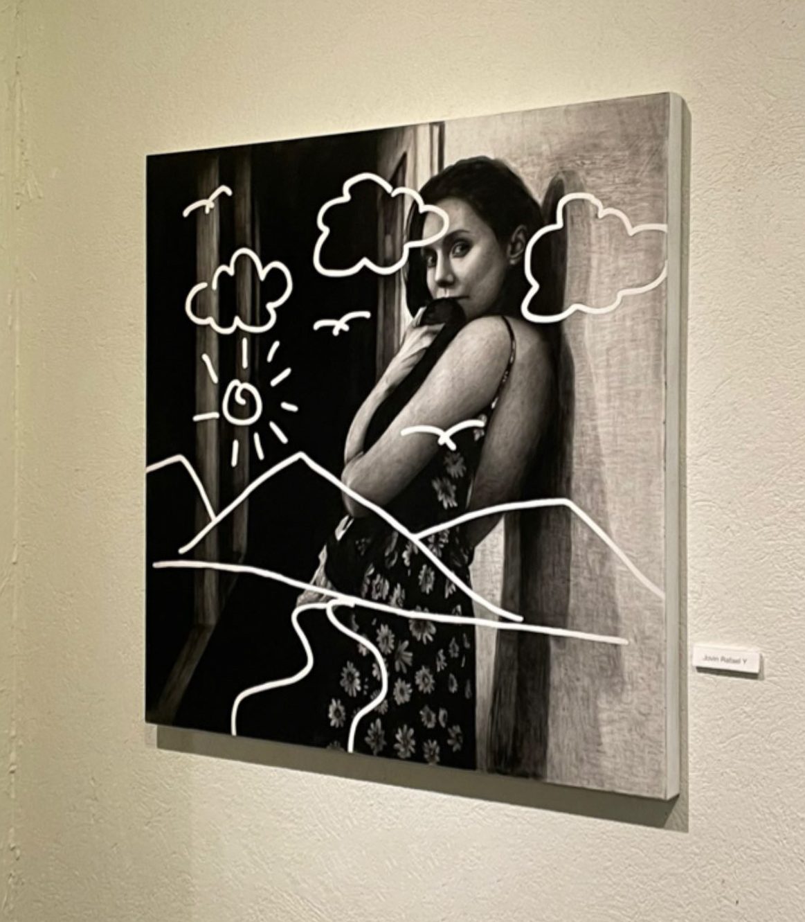 Connected hanging on a gallery wall at Jogja Affordable Art 2, seen from an angle, with its name label beside it